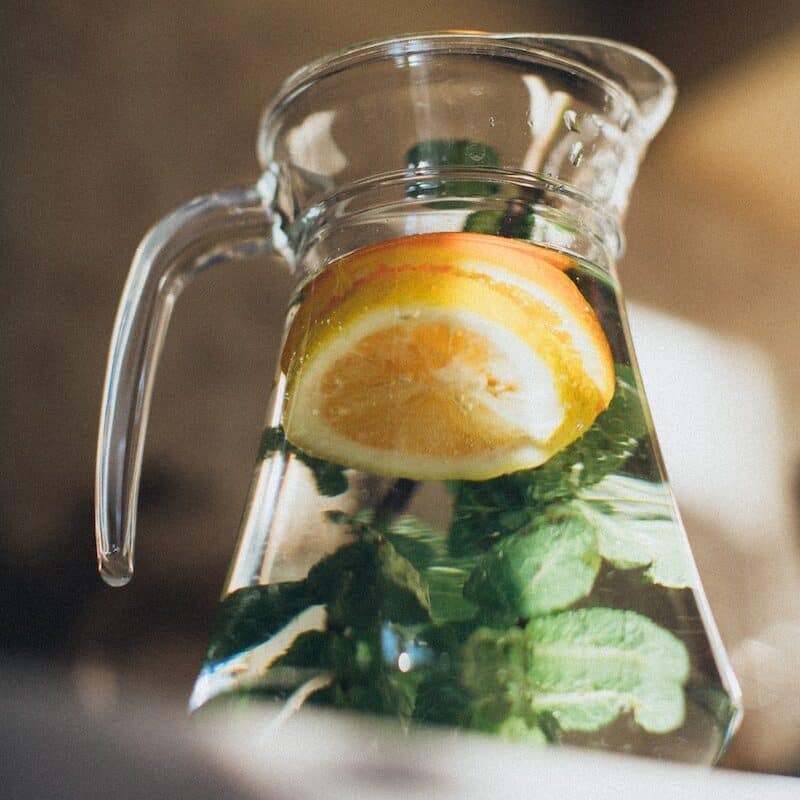 Water With Sliced Lemon in Pitcher - angrylionfitness.com