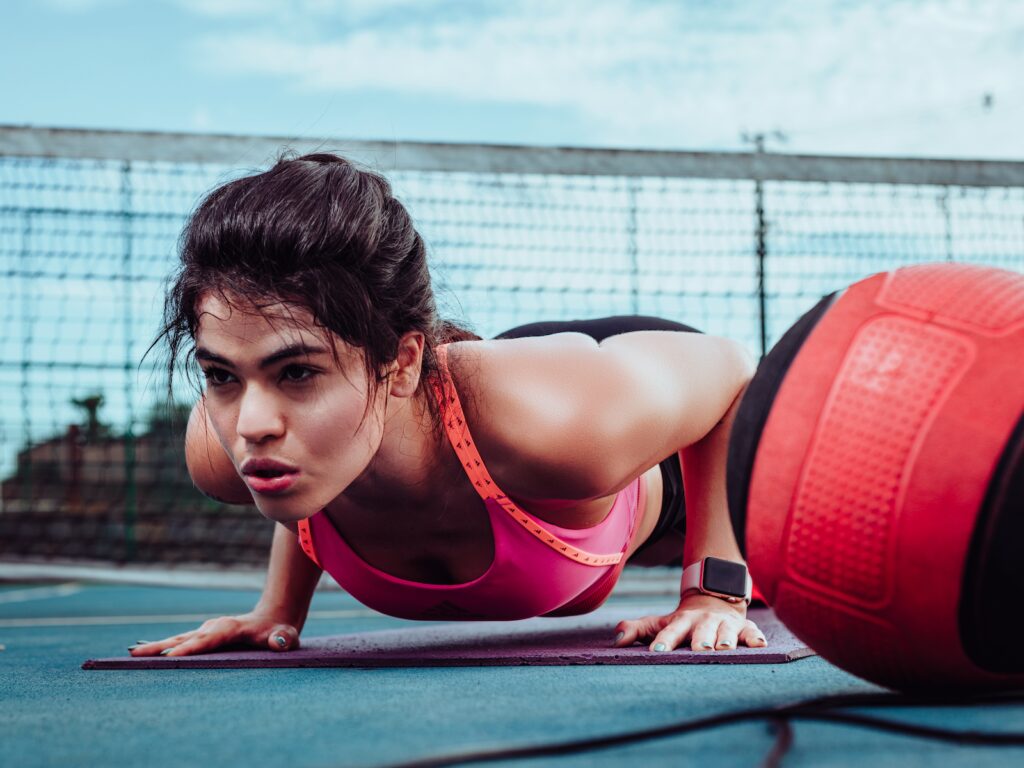 Woman Doing Push-ups on a Tennis Court HIIT