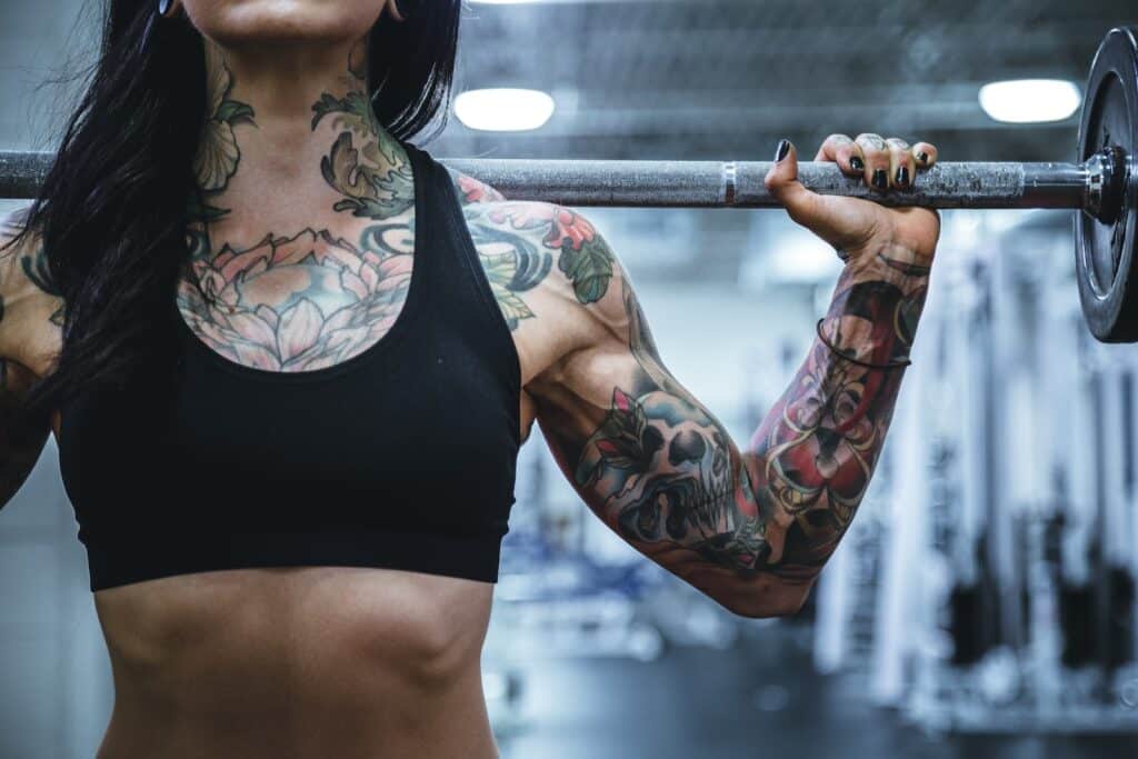 woman carrying barbell Muscle