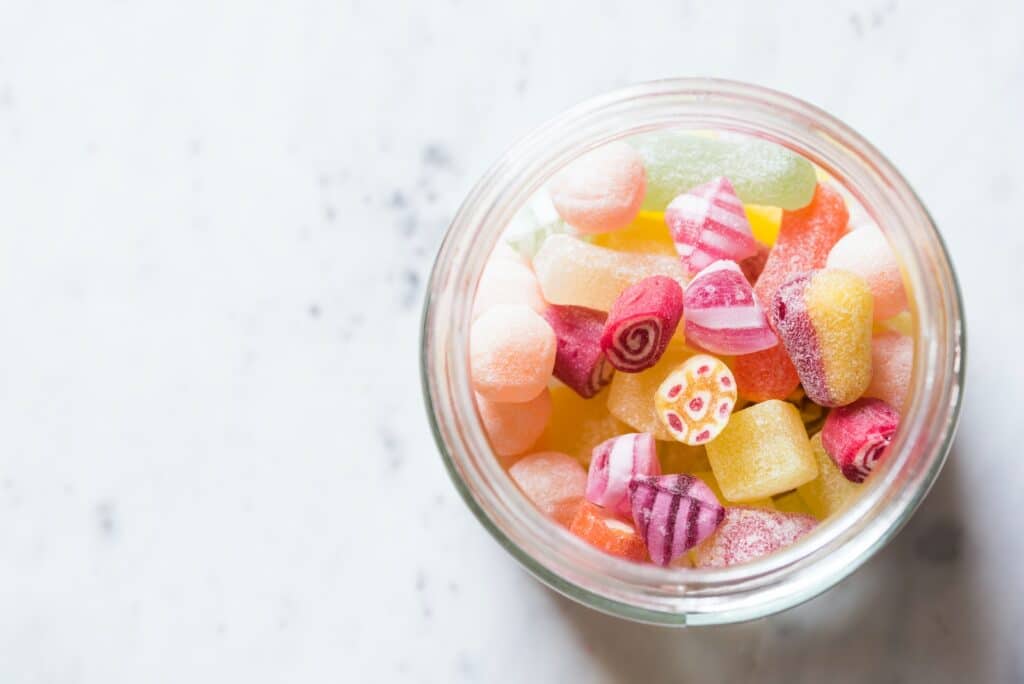 assorted-color candies on container Sugars