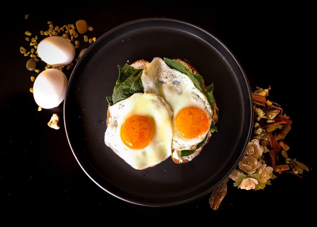 sunny side up egg on black ceramic plate