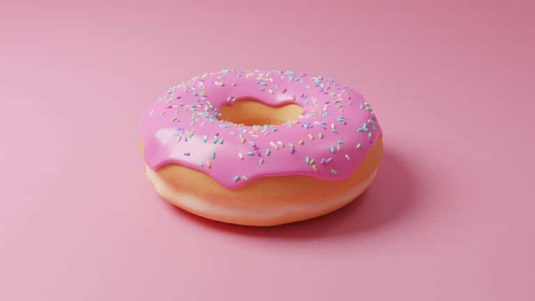 pink doughnut with pink icing on top