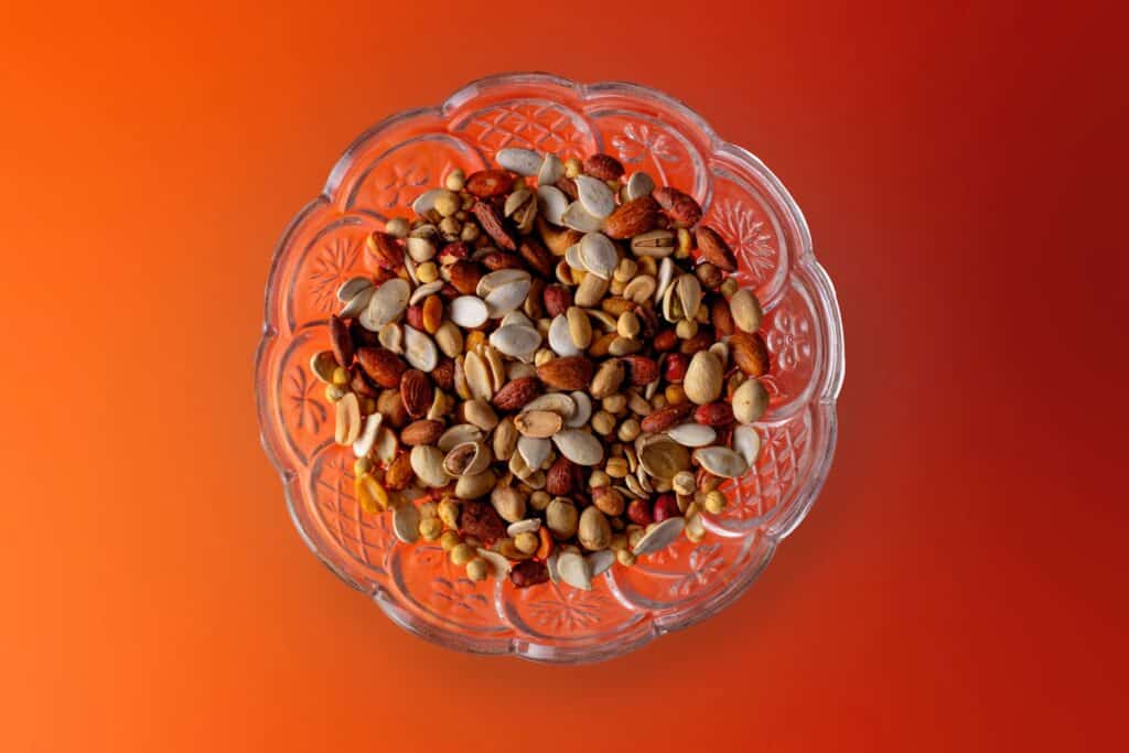 brown and white beans in clear glass bowl