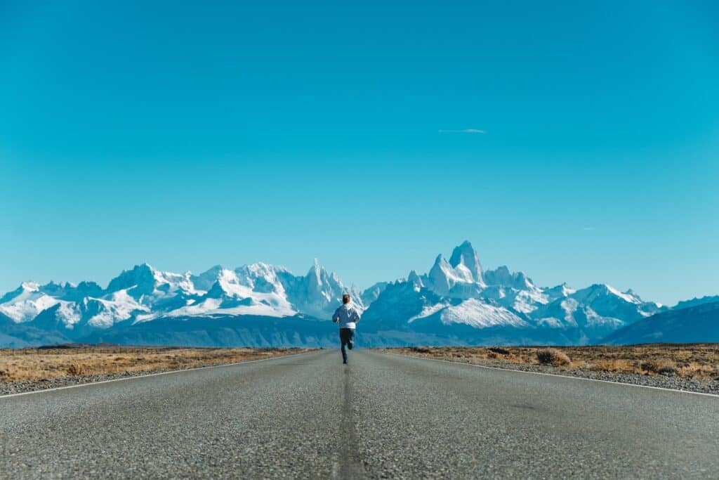 person running on road at daytime Benefits of Running