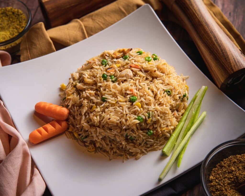 Brown Rice brown and green dish on white ceramic plate